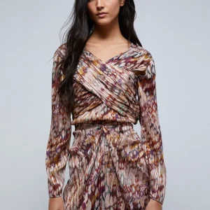 BLUSA PLISADA ABERTURAS